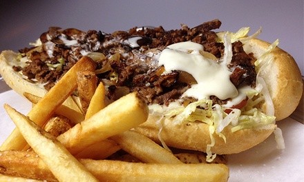 8-in Philly Cheesesteak with Fries or Salad, Dessert, & Craft Beer for 2 or 4 at Monti's (Up to 46% Off)   
